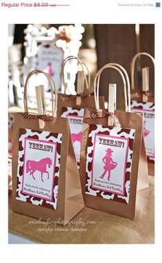 brown paper bags with pink and white designs on them