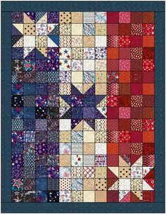 a quilt made with many different colors and patterns