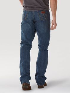 COMFORTABLE, CLASSIC, AND A LITTLE COUNTRY Wrangler® Retro® jeans are a modern take on our authentically Western jeans. Made for country rock stars, rodeo ropers, and those who just happen to have great taste, our men's retro bootcut jeans are a versatile style made to suit any occasion. They offer a comfortable mid rise, relaxed fit through the seat and thigh, and a leg opening that fits perfectly over your favorite pair of boots. Speaking to our Western heritage with a modern sensibility, our Dark Wash Jeans For Rodeo With Five Pockets, Dark Wash Jeans For Rodeo, Medium Wash Denim Jeans For Ranch, Straight Leg Denim Jeans For Ranch, Casual Jeans For Ranch In Medium Wash, Casual Medium Wash Jeans, Straight Leg Denim Blue Jeans For Rodeo, Western Style Standard Cut Denim Jeans, Western Denim Blue Jeans With Five Pockets