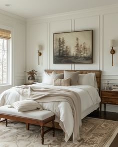 a large bed sitting in a bedroom next to a window