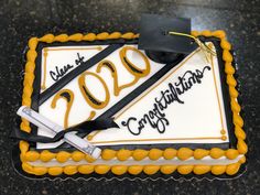 a graduation cake with congratulations written on it