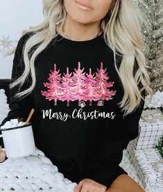 These super cute Pink Christmas Tree Shirts are great for Christmas, the holiday season, winter or anytime you want to spread Christmas cheer! The design features cute pink Christmas tree graphics and the words Merry Christmas in a pretty script font. Purchase for yourself or as a holiday gift for anyone that loves pink and Christmas! ORDERING All shirts, sweatshirts and bodysuits are sold separately. Add shirts to cart individually, then check out. Message us on Etsy if you have any questions. Festive Long Sleeve Christmas T-shirt, Cute Winter Holiday T-shirt, Cute Holiday T-shirt For Winter, Cute Long Sleeve Tops For Festive Occasions, Cute Festive Christmas Tops, Cute Christmas Holiday Tops, Cute Christmas Festive Tops, Cute Long Sleeve Holiday T-shirt, Cute Long Sleeve T-shirt For Holiday