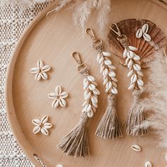 shells, seashells and feathers on a wooden tray