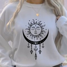 "Sun Moon Sweatshirt Sun Moon T Shirt Mystical Shirt Crystals Shirt Witchy Sweatshirt Astrology Sweater Hoodie Moon Lover Gifts Fall in love with this soft and cozy Boho Sun Moon Cycle Graphic Tee, Sweatshirt or hoodie PLEASE READ ENTIRE DESCRIPTION BEFORE PURCHASING TO MAKE YOUR SHOPPING EXPERIENCE EASIER, YOU CAN \"CHOOSE\" A T SHIRT, SWEATSHIRT OR HOODIE IN THIS LISTING. Available in Shirt, Sweatshirt and Hoodie Tee Shirt Shirt Sleeve Crewneck 100% Cotton Sweatshirt and Hoodies Long Sleeve So Moon Sweatshirt, Moon Lover, Moon Cycle, Boho Moon, Moon T Shirt, Cozy Boho, Boho Sun, Shirt Illustration