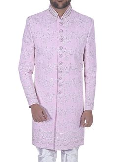 Distinguished Elegance Unveiled: Behold the Splendor of our Exquisite Indian Sherwani Ensemble, a Two-Piece Ode to Opulence and Timeless Style. Fashioned from Luxurious Embroidered Pink Silk, this Sherwani is an Emblem of Regal Grandeur. Accompanied by a White Dupion Pyjama, it masterfully fuses Tradition with Contemporary Flair. An Offering of Distinct Craftsmanship, this Sherwani is a Canvas of Rich Embroidery, Awe-Inspiring in its Detail. A Harmonious Marriage of the Past and Present, it Invites You to Embark on Your Special Day with Unmatched Grace. Noteworthy is the Freedom to Personalize Your Look, as Accessories such as Safa, Mojri, Mala, Stole, and Brooch are Not Included in the Price. This Thoughtful Gesture Empowers You to Curate a Look as Unique and Majestic as Your Love Story. Luxury White Embroidered Sherwani, Luxury Off White Sherwani For Wedding, Luxury White Traditional Sherwani, Luxury Off-white Traditional Sherwani, Luxury Traditional Off White Sherwani, Wedding Sherwani For Men, Indian Sherwani, Sherwani For Men, Bride And Groom Outfit