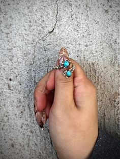 This exquisite ring, expertly crafted by renowned Navajo artist, David Lopez, boasts timeless beauty with a modern twist. Made from .925 sterling silver, its adjustable design allows for comfortable wear and its three color options, classic blue, green turquoise, and white buffalo, offer versatility. Elevate your style with this stunning wrap around star ring. Blue Green Turquoise, Star Ring, White Buffalo, Green Turquoise, Native American Jewelry, Classic Blue, Three Color, Turquoise Blue, Wrap Around