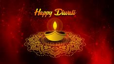 a happy diwali greeting card with a lit candle on a red and gold background