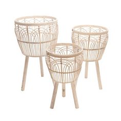 three white wicker baskets sitting on top of each other in front of a white background