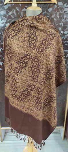 "🔷Vibrant Brown color 100% semi pashmina beautiful \"Jamavar\" Shawl/stole 80\"×28\" is fully fully embroidered by our talented and young artist. Jamavar means which is full covered/fill with embroidery. This shawl/shawl is embroidered by Golden color thread to make shawl/stole more attractive and beautiful.And the thread of this embroidery is silk thread. 🔷The Product is made of combination of wool and Pure Pashmina. 🔷The shawl/stole have beautiful handmade fringes too in the two end. 🔷This Traditional Brown Pashmina Shawl With Patterns, Chikankari Embroidery Jamawar Shawl, Brown Embroidered Pashmina Shawl, Embroidered Jamawar Pashmina Shawl, Pashmina Shawl Scarf With Pallu, Festive Jamawar Pashmina Shawl For Winter, Pashmina Shawl In Jamawar With Traditional Patterns, Unstitched Pashmina Shawl With Pallu, Pashmina Shawl With Chikankari Embroidery