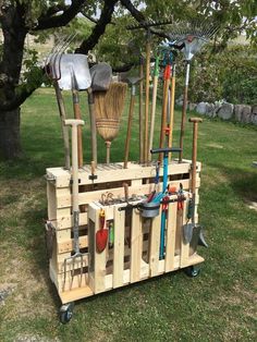 a wooden cart filled with lots of gardening tools