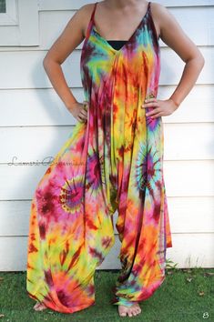 "💥One Size Fits Most Comfortable Tie Dye Hippie Jumpsuits Rompers Pants, Hippie Dress, Wide Legs Jumpsuits, Festival Clothings, Summer Clothing, Harem Dress, Beach Wear 👉One-of-a-kind hand dyed rompers 👉Fabric: 100% Soft and Breathable Rayon 👉Adjustable Tie shoulders 👉Boho/Hippie /Festival/Beach/Tropical/Fancy/UniqueTheme 👉Jumpsuit Length: 48\" 👉Straps Length: 19\" 👉Bust up to 55\" 👉Hip up to 60\" 👉 Tie Dye Method 👉The back is identical to front pattern 👉Flowy open legs 👉One Size Fi Fitted Harem Pants For Summer Festivals, Fitted Bohemian Jumpsuits And Rompers For Beach, Flowy Bohemian Jumpsuits And Rompers For Summer, Fitted Bohemian Jumpsuits And Rompers, Hippie Harem Pants For Summer Festivals, Hippie Style Harem Pants For Summer Festival, Bohemian Summer Harem Pants For Festivals, Bohemian Fitted Jumpsuits For Festivals, Bohemian Multicolor Jumpsuits And Rompers For Spring