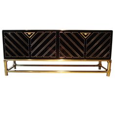 a black and gold sideboard with two doors