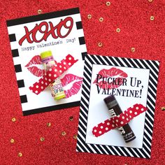 two valentine's day cards with lipstick on them