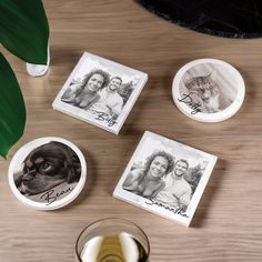 three coasters with pictures of people and a dog on them next to a glass of wine