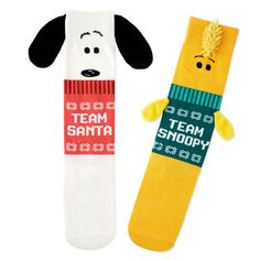 Wear these fun Peanuts Christmas crew socks for a day that's unmatched. These coordinating but mismatched holiday socks feature a white Snoopy sock with "Team Santa" sweater and floppy ear attachments, and a yellow Woodstock sock with "Team Snoopy" sweater and wing attachments. One size fits most adults. | Peanuts Snoopy and Woodstock crew socks feature mismatched holiday designs. | On socks: Team Santa, Team Snoopy. | Makes the perfect Christmas gift or stocking stuffer for a Peanuts fan. | Imported. Cotton, polyester, nylon, spandex. | Machine wash cold. Do not bleach. Line dry. Do not iron. Do not dry clean. | One size fits most adults. Peanuts Snoopy Socks, Harry Potter Pets, Snoopy Sweater, Kids Milestones, Grinch Who Stole Christmas, Santa Sweater, Holiday Socks, Peanuts Christmas, Soft Sock