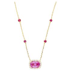 GRS certified 5.10 carat no heat cushion cut Ceylon origin pink sapphire necklace. The pink sapphire is prong set in 18k yellow gold and encompassed by 20 round cut diamonds that total 0.46 carats. On the chain of the necklace are 8 round cut rubies bezel set in 18k yellow gold. This necklace is a statement piece with natural gemstones that will turn heads and earn compliments wherever you go. Something that no one else has. Details:  ✔ Item type: Floating pendant necklace ✔ Metal: 18k yellow gold ✔ Weight: 4.89 grams ✔ Setting: bezel, prong ✔ Length: 18 Inches Stone Details: ✔ Gemstone: Sapphire ✔ Carat: 5.10 ✔ Color: Pink ✔ Cut: Cushion ✔ Origin: Ceylon (Sri Lanka) ✔ Treatment: No heat GRS Certified Side Stone Details: ✔ 20 round cut diamonds, 0.46 CTTW ✔ 8 round cut rubies, 1.41 CTTW Pink Sapphire Necklace, Victorian Pendant Necklace, Retro Engagement Rings, Sapphire Diamond Necklace, Art Deco Pendant Necklace, Victorian Pendants, Floating Necklace, Drop Pendant Necklace, Filigree Pendant