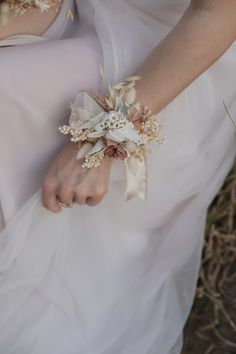 the bride is holding her bouquet in her hand