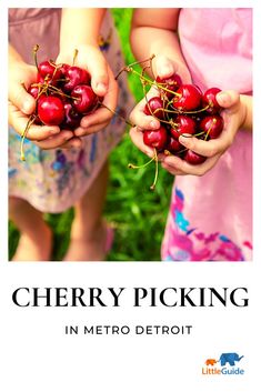 two children holding cherries in their hands with the title cherry picking in metro detroit