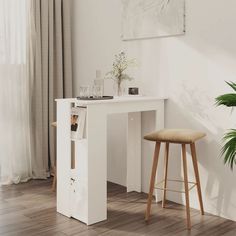 a white desk and stool in a room