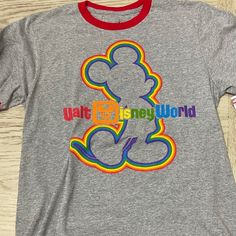 New With Tags Rainbow Disney Shirt Graphic Tee For Disney Fan Events In Multicolor, Multicolor Graphic Tee For Disney Fan Events, Multicolor Cartoon Print T-shirt For Disney Fan Events, Casual Multicolor T-shirt For Disney Trips, Casual Crew Neck T-shirt For Disney Trips, Disney Multicolor Letter Print T-shirt, Multicolor Mickey Mouse T-shirt For Disney Events, Fun Crew Neck T-shirt For Disney Trips, Multicolor Cartoon Print T-shirt For Disney Trips