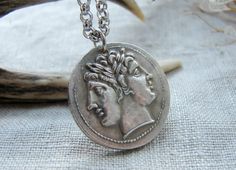 This gorgeous necklace I created using copy of ancient Roman coin with Janus  Coin diameter 2.4 cm or 1 inch Please choose a necklace length: 1. Necklace adjusts from 43 to 53 cm or from 17 to 21 inches 2. Necklace adjusts from 51 to 61 cm or from 20 to 24 inches 3. Necklace adjusts from 58 to 68 cm or from 23 to 27 inches 4. Necklace adjusts from 63 to 73 cm or from 25 to 28 inches It is a copy of a the Roman Republic ancient silver coin. Obverse: Laureate head of Janus or the twinned Dioscuri. Silver Symbolic Coin Necklaces, Symbolic Silver Coin Necklace, Silver Coin Necklaces With Symbolic Style, Silver Engraved Symbolic Coin Necklace, Symbolic Coin-shaped Nickel-free Necklace, Symbolic Nickel-free Coin Necklaces, Symbolic Nickel-free Coin Necklace, Symbolic Coin Shaped Nickel Free Necklace, Symbolic Silver Round Coin Necklace