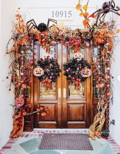 the front door is decorated with halloween decorations