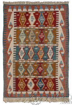 an old rug with different colors and patterns