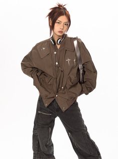 This stylish bomber jacket comes with shoulder patches, cross embellishments, and an asymmetric button up. Instantly elevate any look with this versatile and fashionable piece. Model is 5'4 115lbs wearing L Camo Jeans, Paint Tool Sai, Star Cross, Blue Vests, Oversized Denim Jacket, Oversized Jacket, Fitted Trousers, Relaxed Fit Jeans, Blue Skirt