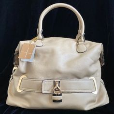 Brand New W/ Tags. Soft Inside Lining Is A Deep Blue Color W/ White And Green Triangle Accents (Mostly All White). Lock Accessory On Front. Removable Adjustable Shoulder Strap. Small Protection "Feet" On Bottom. Three Inside Pockets, One Being A Zip Closure. Beige Top Handle Satchel With Silver-tone Hardware, Beige Travel Bag With Silver-tone Hardware, Beige Satchel With Hasp Closure For Shopping, Beige Satchel With Hasp Closure And Tote Shape, Beige Bag With Silver-tone Hardware And Double Handle, Beige Bags With Silver-tone Hardware And Double Handle, Beige Tote Hobo Bag With Silver-tone Hardware, Beige Hobo Bag With Silver-tone Hardware, Beige Hobo Bag With Silver-tone Hardware For Everyday Use