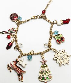 Christmas Charm Bracelets. Like Pandora charms but all on a bracelet! Most have extenders on them. Only the pink one does not.   *If you need faster shipping for Xmas, send us a message and we can calculate that for you.* Christmas Charm Bracelet Gift, Christmas Gift Charm Bracelet, Pink Adjustable Christmas Jewelry, Charms Pandora, Christmas Charms, A Bracelet, Pandora Charms, Charm Bracelets, Jewelry Bracelets