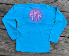 This listing is for one long sleeve cotton unisex jersey style shirt with large back design!! You can add a monogram or single letter to the front if you add a note in the note area at check out along with the other details for the back. We can do a large appliqué monogram on the back, school name, business name, seniors- Any school, any business, any colors, whatever matches your function! You can change or request any color you want and we will get as close as possible. Message if you have any School Spirit Long Sleeve Tops, Pre-shrunk Long Sleeve Shirt For Spring, Blue Tops With Custom Print For School Spirit, Custom Print Long Sleeve Top For College, Custom Print Long Sleeve College Tops, Long Sleeve School Spirit Tops, Pre-shrunk Long Sleeve Shirt For College, Long Sleeve Tops With School Spirit, Long Sleeve Tops For School Spirit