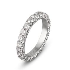 a white gold ring with rows of diamonds