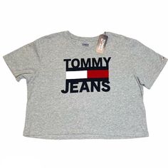 Nwt Tommy Jeans Tommy Hilfiger Cotton Crop Top Tee Gray T-Shirt Size: M Flat Measurements: Front- From Shoulder To Bottom Hem Approx. 19” (Front Length Slightly Shorter Than Back Length) Trendy Gray Tops With Logo Print, Tommy Hilfiger Crew Neck Top For Summer, Tommy Hilfiger Summer Crew Neck Top, Trendy Tommy Hilfiger Crew Neck Top, Tommy Hilfiger Graphic Tee With Letter Print, Trendy Tommy Hilfiger Tops With Graphic Print, Tommy Hilfiger Casual Crew Neck Tops, Trendy Tommy Hilfiger Cotton Tops, Tommy Hilfiger Tops With Logo Print For Spring