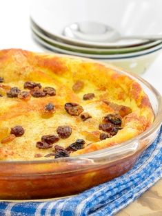 a casserole with raisins and cheese in a dish on a table