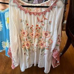 Embroidered Tunic Spring Bohemian Embroidered Top With Floral Details, Bohemian Embroidered Top With Floral Design For Spring, Bohemian Floral Embroidered Top For Spring, Bohemian Spring Embroidered Top With Intricate Details, Floral Embroidered Long Sleeve Top For Vacation, Long Sleeve Floral Embroidered Top For Vacation, Multicolor Embroidered Long Sleeve Top For Spring, Multicolor Long Sleeve Embroidered Top For Spring, Summer Long Sleeve Embroidered Top With Floral Print