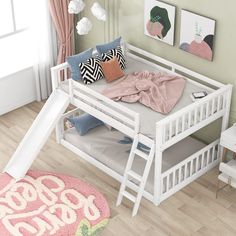 a child's bed with a slide in the middle and pillows on top of it