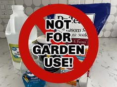 a sign that says not for garden use in front of a counter top with cleaning products