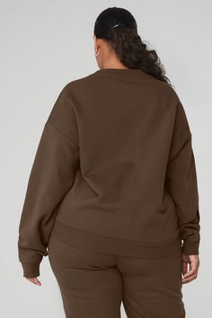 This best seller is cozy, comfortable, cute and done in classic neutrals and on-trend colors—each finished with a chrome Alo logo. It has a classic crewneck, ribbed cuffs and hem, and a laid-back dropped-shoulder fit. It’s made from midweight French terry that’s smooth on the outside and fleecy on the inside with the perfect drape. Pair with the Accolade sweatpants to make a matching set—and get one for your bestie, sibling, or partner, if you’re into that. Brown Crew Neck Sweatshirt For Layering, Oversized Brown Sweatshirt For Layering, Alo Yoga Sweater For Fall Loungewear, Alo Yoga Fall Sweater For Loungewear, Cozy Brown Sweatshirt For Loungewear, Casual Solid Sweats With Ribbed Collar, Casual Cozy Fit Sweatshirt By Alo Yoga, Alo Yoga Casual Cozy Fit Sweatshirt, Alo Yoga Sweater For Winter Loungewear