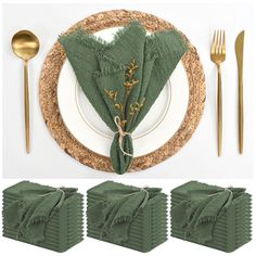 a place setting with green napkins and gold cutlery on the side, along with forks and spoons