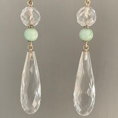 A fabulous original pair of Art Deco, 9ct Gold, Rock crystal & Jade, long drop earrings c1930s The earrings hang resplendently from the earlobes, pendulum like in their movement, the Rock crystal Quartz are briolette cut, a round section at the top, with a smaller mottled Jade bead set below, chain linked making them fully articulated. The large teardrop rock crystal section in suspended below like a drop of water, each facet reflecting the light beautifully. The earrings are stunning and generously sized yet due to the clear Rock crystal they have a light and ethereal appeal They are on 9ct Gold hook fittings for pierced ears which are likely to be replacements from the original screwback fittings Weight: 16.1 grams combined Dimensions: 5.8cm long x 11.2mm at the widest point Condition: E Classic Chandelier Dangle Earrings With 17 Jewels, Vintage Drop Earrings With Matching Set, Vintage Drop Jewelry Set With Matching Earrings, Vintage Drop Earrings For Pierced Ears, Faceted Long Drop Earrings For Anniversary, Classic Faceted Drop Jewelry, Classic Faceted Dangle Earrings, Classic Dangle Faceted Earrings, Classic Drop Jewelry With Faceted Details