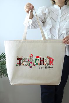 Christmas Teacher Bag, Personalized Christmas Gift Tote Bag, Christmas Bag, Shoulder Bag For Teacher, Custom Teacher Tote Bag HOW TO ORDER: 1. Please, Check and Review all Photos.  2. Select Your Bag Style and Color from the drop-down menu 3. Choose Your Quantity as much as you want. 4. Click "Add To Cart". For multiple items go back to the listing and repeat the steps. *DETAILS OF THE BAGS: 25L Tote Bag Measurements - 20"L x 15"H x 5"D 100% cotton , 25" self-fabric handles , 11" handle drop Large main compartment with zippered closure Inside zippered flap pouch pocket * PROCESSING & SHIPPING: Processing time is 1-2 days. First Class Shipping is 2-5 business days (after processing time). You can upgrade your shipping on the check out page to UPS Ground and UPS-2 Day Business Services (afte Christmas Teacher Gifts, Christmas Gift For Teacher, Teacher Custom, Teacher Tote Bag, Teacher Bag, Teacher Bags, Christmas Tote Bags, Teacher Tote, Christmas Tote