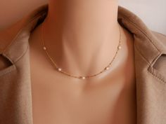 dainty gold choker dainty pearl choker gold rosary choker gold chain choker necklace gold satellite chain gold satellite necklace A beautiful pearl necklace on a satellite chain. Five freshwater pearls and a satellite chain make this necklace of a beautiful and elegant jewel! It can be made on a sterling silver or gold vermeil chain. Please, message me if you want a specific length that is not shown in the menu or if you are not sure of the length. Pearls may have imperfections as they are natur Gift Pearl Necklace With Satellite Chain, Dainty 14k Gold-filled Pearl Chain Jewelry, Dainty Pearl Necklace With Pearl Chain, Dainty 14k Gold Filled Pearl Chain Jewelry, Minimalist Pearl Necklace With Satellite Chain As Gift, Dainty Pearl Necklace With Satellite Chain, Dainty Pearl Pendant Choker, Delicate Pearl Necklace With Satellite Chain, Dainty Pearl Chain Jewelry