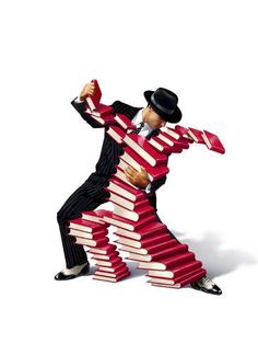 a man in a suit and top hat is standing on stacks of books with his arms stretched out