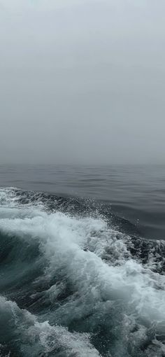 the ocean is very choppy and gray in color