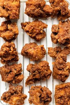 several pieces of fried chicken on a cooling rack