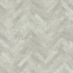 a white and grey tile wallpaper with an irregular chevron pattern on the floor