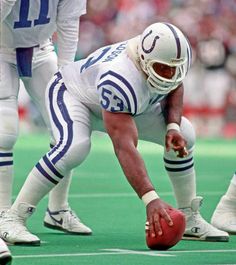 a football player kneeling down on the field