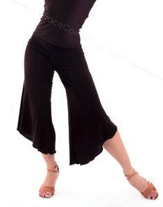 "Stylish and comfortable dance capri pants made of flowy knit. The relatively wide leg of the trousers, the length to the mid-calf gives freedom and ease to your movements. Capri pants go well with form-fitting tops. INDIVIDUAL TAILORING If you want to change the style of clothes (shorten, make it longer, add a sleeve, etc.) you can order individual tailoring from us. You can also individually order ANY SIZE of clothes from us up to size XXS or over size 7X. Our consultant will be happy to tell Fitted Wide-leg Summer Capris, Fitted Solid Culottes For Casual Wear, Versatile Stretch Capri Pants, Fitted Solid Color Culottes For Casual Wear, Versatile Fitted Harem Pants For Summer, Elegant Stretch Capri Bottoms, Elegant Stretch Capris, Fitted Versatile Capri Length Bottoms, Elegant Stretch Capris For Summer