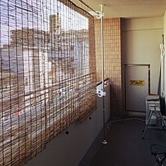 a room with a wall covered in lots of wire mesh covering it's walls