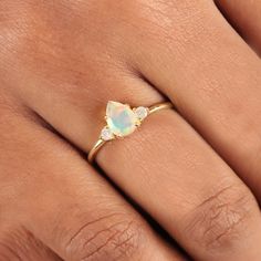 ⚫ Genuine Pear Design Ethiopian Opal Gemstone & Diamond Ring Solid 14K Yellow Gold Handmade Jewelry Wedding, Birthday Gift For Her ⚫ This ring is made with genuine Ethiopian Opal gemstone & diamonds in solid 14k yellow gold, ⚫ Solid 14K Gold Ethiopian Opal Gemstone Ring Handmade Pure Gold Jewelry. ⚫ Ethiopian Opal Ring, Engagement Ring, Wedding Bands, Gold Ring, Gemstone Ring. ⚫ Special customize for Anniversary, Birthday Gift, Valentine's, Mother's Day, Christmas. ⚫ Item Details: Gross Weight:- Gold Three Stone Birthstone Ring For Wedding, Three Stone Pear-shaped Jewelry Gift, 14k Gold Opal Halo Ring For Wedding, Gold Cluster Ring With Three Stones For Wedding, Pear-shaped Three Stone Jewelry Gift, Wedding Opal Ring With Halo In 14k Gold, Wedding Diamond Ring With Opal Gemstone, Yellow Gold Three Stone Birthstone Ring For Wedding, Opal Gemstone Wedding Ring